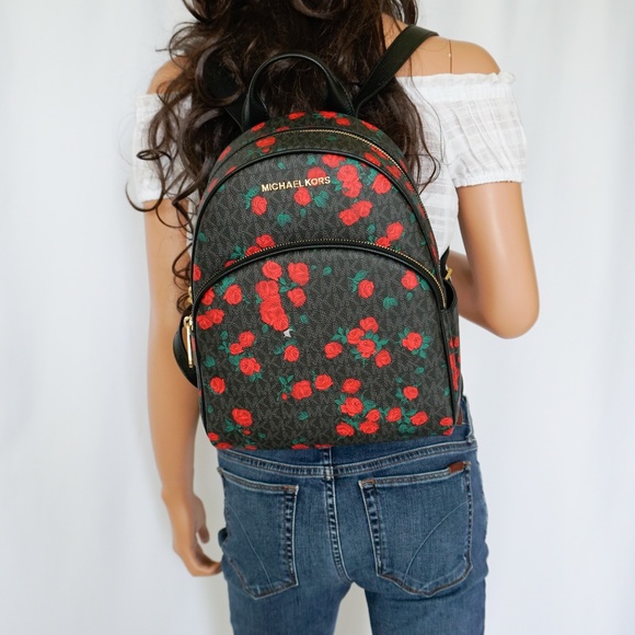 black backpack with red roses